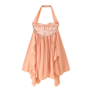 Detailed view of the layered ruffle hem on the nude pink halter neck mini dress