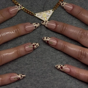 French leopard print press-on nails with 3D cherry design on long almond shaped tips
