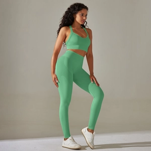 Detailed seamless knit texture on a mint green sports bra and high-waisted yoga leggings