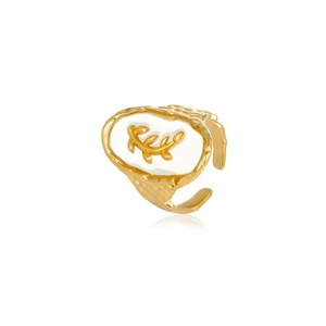Detailed view of ocean-themed open ring featuring gold leaf relief on white oval surface