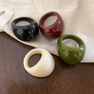 Set of four minimalist thick resin rings in black, burgundy, cream and olive green colors