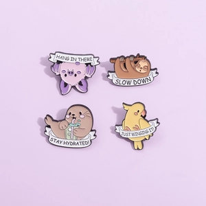 Cute set of four animal enamel pins featuring a sloth, seal, cockatiel, and bat on metal