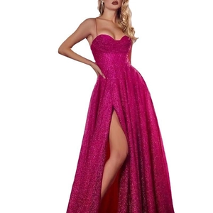 Detail of rose red sequin gown with thin straps and high slit on shimmering fabric
