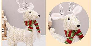 Close-up of floral fabric reindeer ornament with knit scarf and antler details