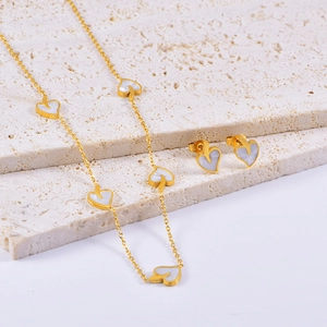 Elegant gold-plated stainless steel jewelry set with white heart pendant and earrings