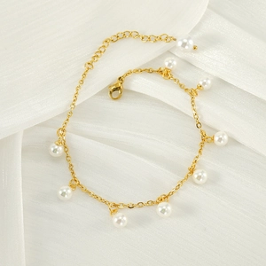 Elegant 18K gold plated stainless steel anklet with white pearl charms on white fabric