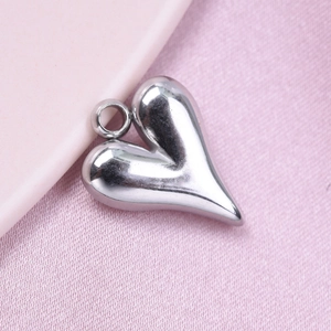 Detailed close-up of a 304 stainless steel heart pendant with silver polished finish