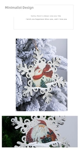 Detail of snowflake wooden Christmas ornaments with festive hand-painted illustrations