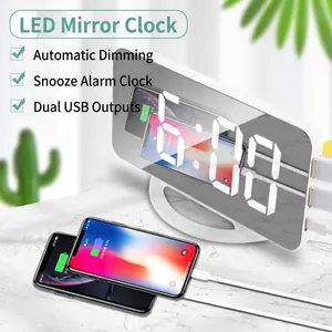 LED mirror digital alarm clock with white display and dual USB charging ports for phones