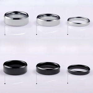 Polished stainless steel rings in 4mm 6mm and 8mm widths showing silver and black finishes