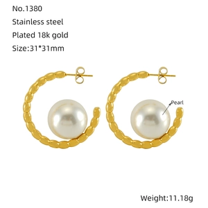 18k gold plated stainless steel hoop earrings featuring a large central white pearl