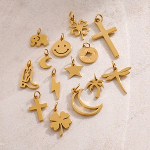 Golden stainless steel charm pendants featuring four-leaf clover star and moon shapes