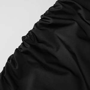 Close-up detail of the gathered ruched texture on this black slim-fit off-shoulder dress