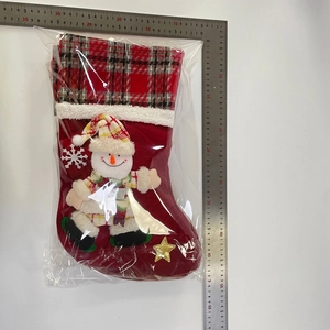 Macro view of 45cm Christmas stocking with snowman embroidery and measurement ruler