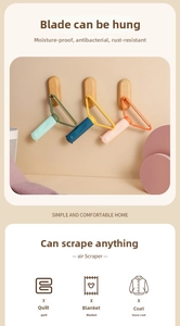 Manual lint scraper with animal-shaped handle for removing fuzz from coats and blankets