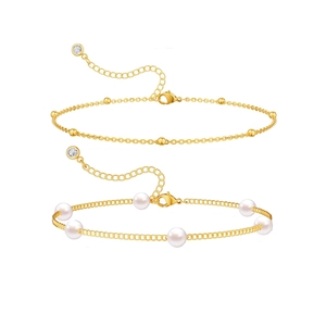 Elegant gold bead and white pearl adjustable bracelet set with diamond charm on white background