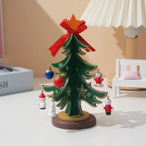 Detailed close-up of a mini wooden Christmas tree with festive ornaments and star topper