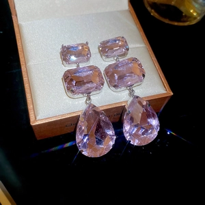 Silver drop earrings featuring pink square and teardrop crystals in a prong setting