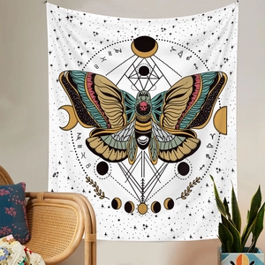 Detail of bohemian butterfly tapestry with zodiac signs and skull moth on a cozy wall