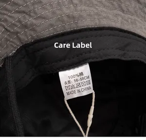 Détail de l'étiquette 100% coton et de la couture intérieure du chapeau de soleil gris foncé