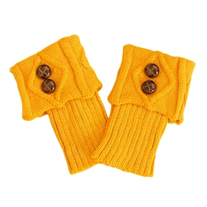 Detail of ginger knit leg warmers with vintage buttons and diamond knit texture