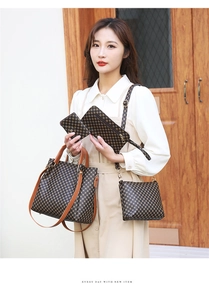 Close-up of four-piece vintage checkered handbag set worn by model in home setting