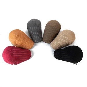 Detailed overhead view of cotton flat caps in six colors with subtle vertical stripes
