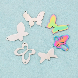 Set of six stainless steel butterfly pendants in silver and rainbow finishes