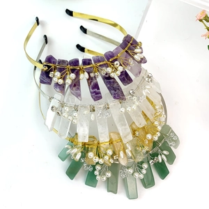 Detailed craftsmanship of handmade crystal crown headbands with pearls and gold wire wrapping