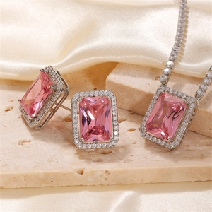 Elegant jewelry set with pink rectangular stones and silver finish on textured stone