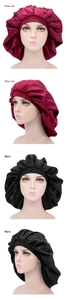 Detail of satin hair bonnets in wine red and black with elastic bands for long hair