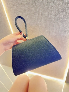 Elegant black glitter trapezoid evening bag with gold beaded top handle and metal hardware