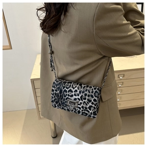 Fashionable leopard print crossbody bag with metal chain strap and secure square lock
