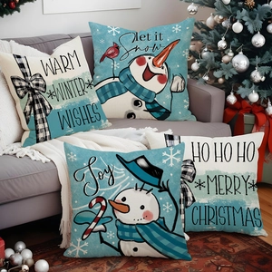 Set of 4 Christmas snowman throw pillow covers on sofa with festive decorations