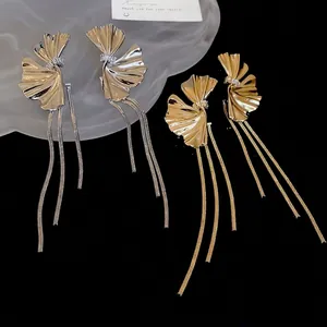 Elegant ginkgo leaf dangle earrings with long metal tassels and zircon accents