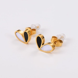 Detail of heart stud earrings featuring two-tone black and white mother of pearl inlay