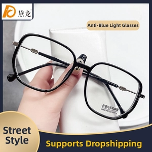 Detail of round frame blue light glasses featuring CD metal hinges and UV400 lenses