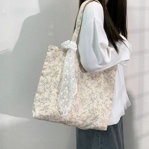 Floral canvas tote bag in beige with blue flower print and delicate lace ribbon decoration