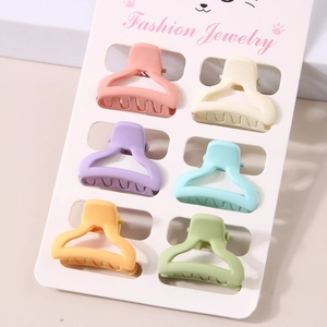 Detail of 6pcs colorful mini matte hair claws on display card for hair styling