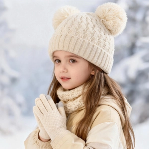 Detail of baby winter set with pineapple knit beanie double fur pom-pom and scarf