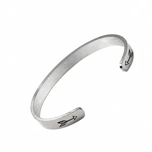 Minimalist silver stainless steel open bangle with motivational laser engraving