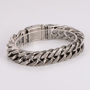 Close-up of vintage silver cuban link bracelet with detailed four-sided grinding