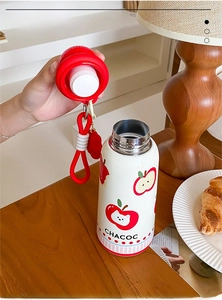 Detail of white stainless steel thermos with leak-proof silicone seal and red carry strap