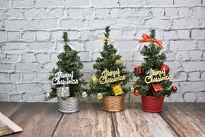 Mini tabletop Christmas trees in gold, silver and red with festive knit-texture pots
