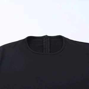 Detail of round neckline and back zipper on black long sleeve jumpsuits fabric