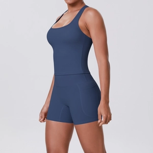 Detail of racerback yoga top and high-waisted shorts with pocket in dark blue