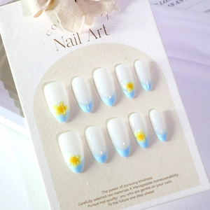 Short round French blue press-on nails with 3D yellow tropical flower designs