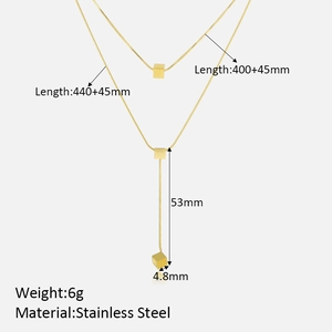 Detail view of gold double-layer stainless steel necklace with cube pendant dimensions
