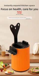 Close-up of orange rotating kitchen knife holder with integrated knife sharpening module