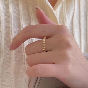 Minimalist 925 sterling silver beaded open ring in gold finish worn by model